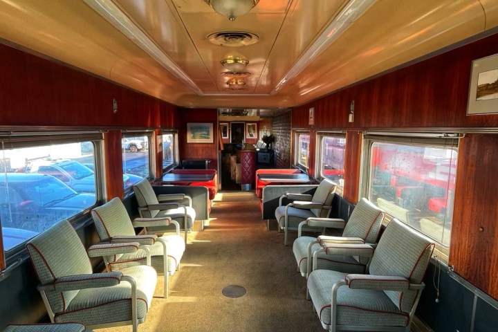 a living room filled with furniture and a large window