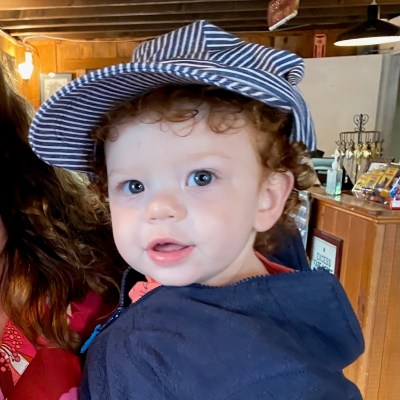 a little boy wearing a hat