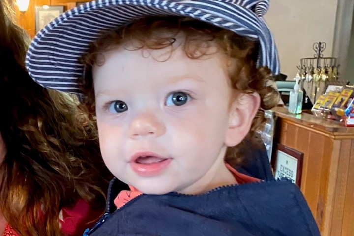 a little boy wearing a hat
