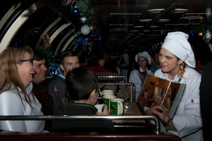 a group of people sitting at a train station