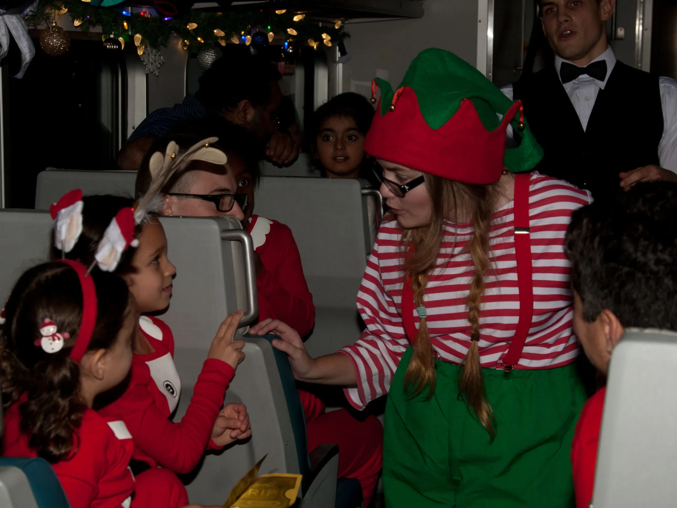 a group of people standing next to a child