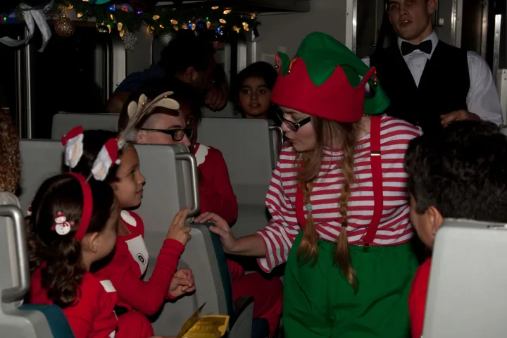 a group of people standing next to a child