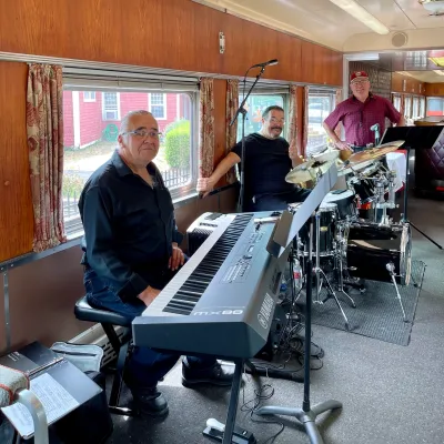 a man sitting at a table with a laptop