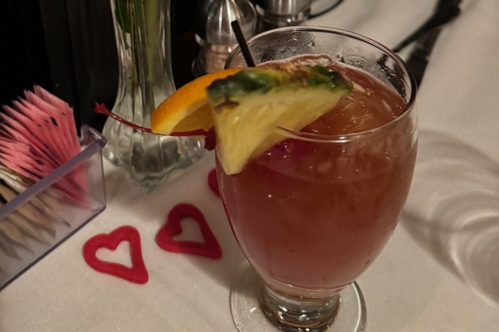 a glass of orange juice on a table