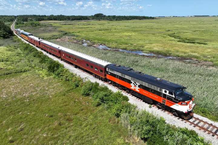 a large long train on a steel track