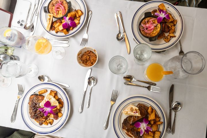 a table topped with plates of food on a plate